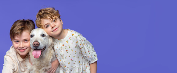 Happy children with favorite pet golden retriever dog over purple background banner. Concept of veterinary, family, education. Copy space for design