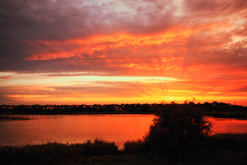 Fototapeta na wymiar Beautiful sunrise on the river bank, place for fishing