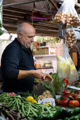 Man selling fruits and vegetables at the market