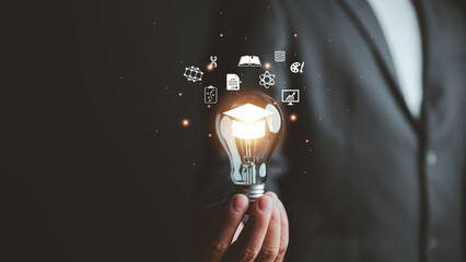 E-learning graduate certificate program concept. man holding lightbulb showing graduation hat, Internet education course degree, study knowledge to creative thinking idea and problem solving solution - obrazy, fototapety, plakaty