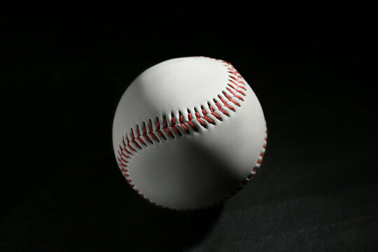 Baseball ball on black background, closeup. Sports game