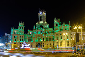 Fototapeta na wymiar town hall and plaza de cibeles at night illuminated in green