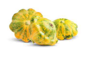 Three fresh yellow pattypan squashes on white background