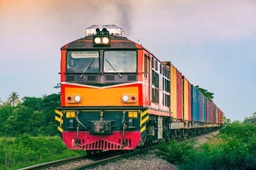 Container-freight train by diesel locomotive on the railway.