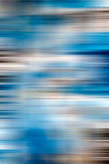 Vertical abstract. Blue background. with horizontal fuzzy stripes of brown, gold, and white. A beautiful background.