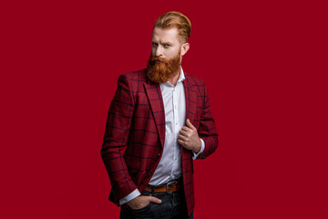 bearded man in formalwear suit at studio. man in formalwear suit on background.