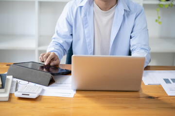 Asian businessman  In the Data Mining Center Statistician with Monitors Displaying business finance technology and investment. Stock Market Investments