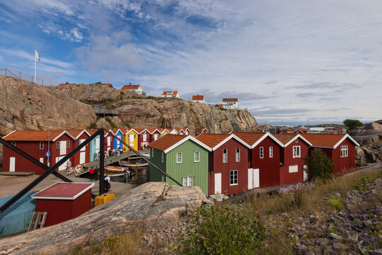 Colorful wooden fishing huts in the picturesque coastal town of Sm&ouml;gen in Sweden.
