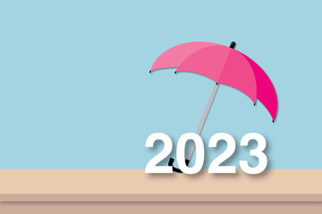 Pink umbrella with paper 2023 year on table and soft blue background. Concept for business protection in 2023. shadow overlay. copy space for the text. Illustration of paper cut minimal design style.