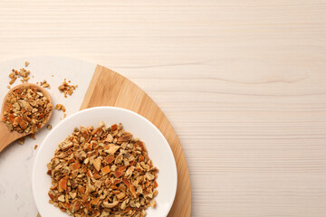Tray with dried orange zest seasoning on wooden table, top view. Space for text
