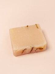 Organic soap on pink background. Handmade natural cosmetics. Soap for delicate, sensitive skin. Vertical