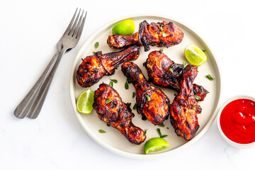 BBQ Grilled Chicken Legs with Ketchup Top Down Close Up Photo