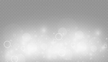 Dust sparks and stars shine with a special light. Christmas light effect. Glittering particles of magic dust.Vector sparkles on a transparent background.