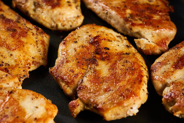 Fried chicken breast in the pan