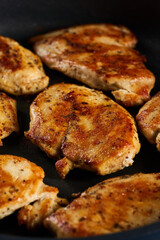 Fried chicken breast in the pan