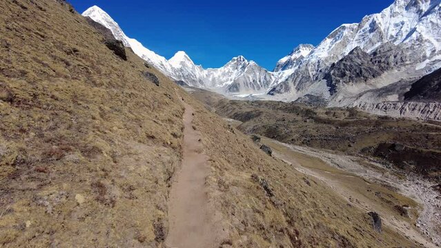 Everest, Nepal: Point of view of an hiker walking along the Khumbu valley to Gorak Shep and the Everest base camp in the Himalayas in Nepal