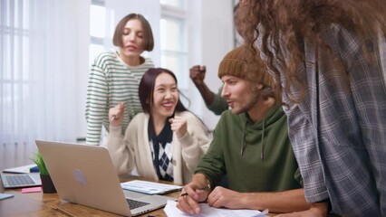 happy business team celebrating near the desktop. Slow motion 60fps 4k.
