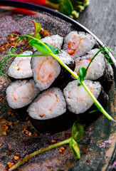 set of sushi roll in plate