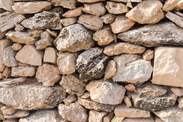 A wall of sharp fragments of local stone on the island of Malta.