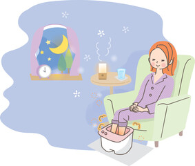 夜寝る前に足湯でリラックスする女性