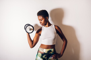 black woman with a dumbbell
