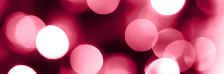 Viva magenta blurred lights abstract panoramic background banner. Holiday defocused bokeh header