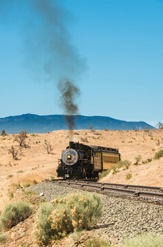 Steam trail driving though Nevada desert.   Virgina & Truckee Railroad