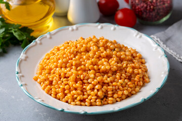 Couscous pilaf with tomatoes. Turkish name; domatesli kuskus pilavi