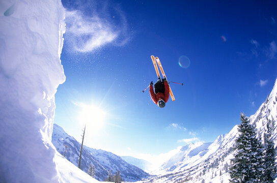 Skier hitting a jump on his skis at Alta, Utah