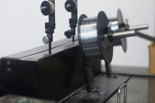 Part of printing Machinery with reel and silver threads