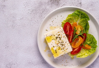 Food photography of feta cheese salad, greek, tomato, romaine, cheese, lettuce, seasoning, olive oil