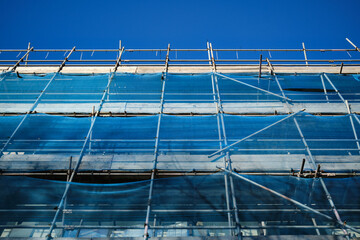 scaffolding and safety netting on a construction site
