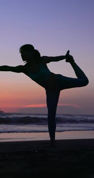woman practice yoga on beach