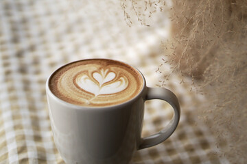 cup of cappuccino with cinnamon