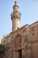 Fototapeta na wymiar Cairo, Egypt- June 26 2020: Moez Street with few local visitors and Sabil-Kuttab of Katkhuda Mamluk era historic building at the far end during Covid-19 lockdown period, Gamalia district, Old Cairo