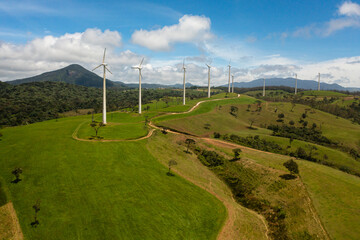Fototapeta na wymiar Aerial drone of Group of windmills for renewable electric energy production. Wind Power Station. Ambewela, Sri Lanka.