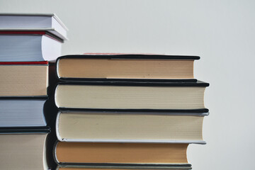 Books in front of white wall
