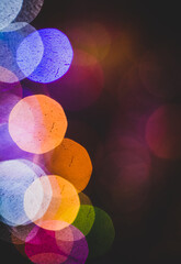 Multicolor, disco bokeh against color background with copy space.