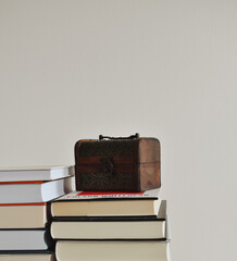 There is a chest on the books
