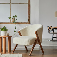Stylish compositon of modern living room interior with frotte armchair, wooden commode, side table...