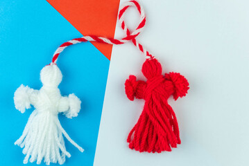 Traditional Martisor - symbol of holiday 1 March, Martenitsa, Baba Marta, beginning of spring and seasons changing in Romania, Bulgaria, Moldova. Greeting and post card for holidays.