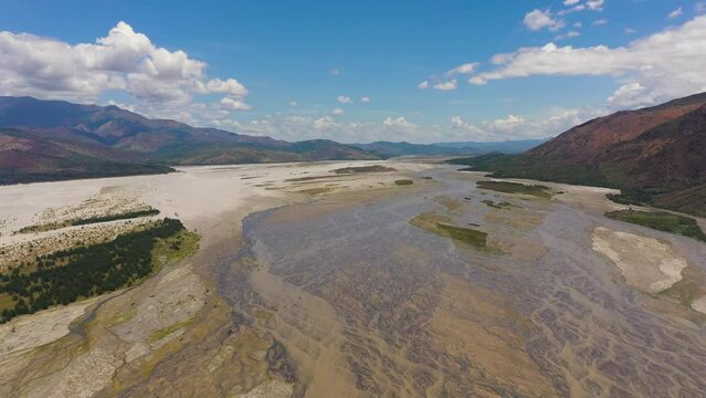 Top view of shallow river bed in a mountain valley. Bucao river. Luzon, Philippines.