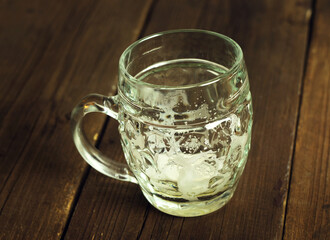 empty beer glass mug on wooden table