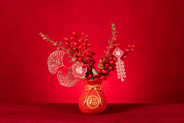potted plant for Chinese new year on red at horizontal composition translation of the Chinese is fortune no logo no trademark