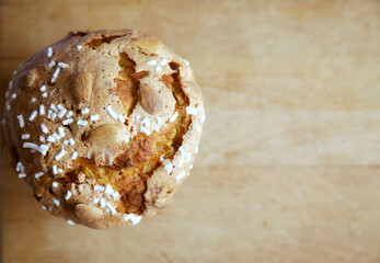 Traditional italian Panettone, typical Christmas cake, on a chopping board. Top view.
