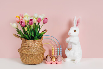 Spring flowers, Easter Bunny and eggs. Home interior with easter decor.   Children's room in the...