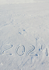 new year 2024. figures in the snow. background for winter holidays.