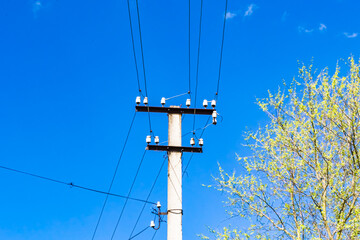 Power electric pole with line wire on colored background close up