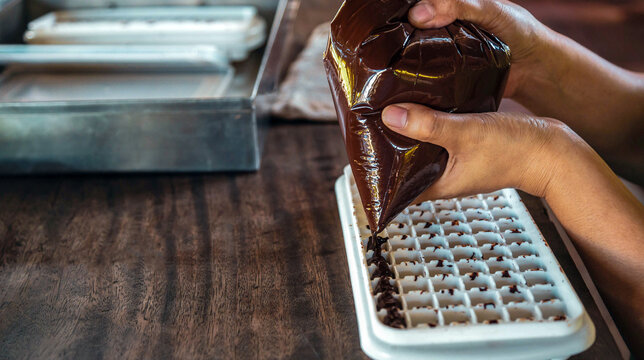 Close up of hand chef making homemade chocolate bars