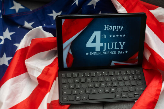 american flag and digital tablet on table